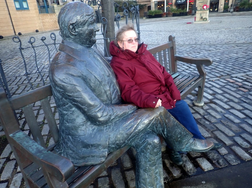 Sitting with statue